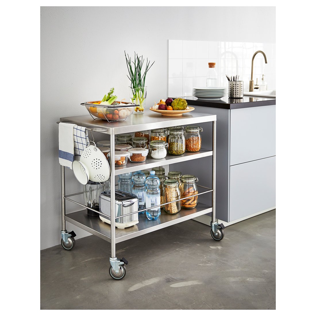 Stainless steel kitchen trolley with castors in use