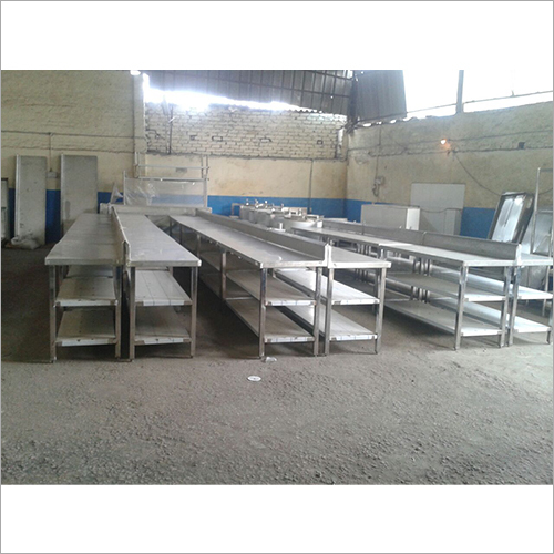 Stainless steel commercial work tables in a fabrication area